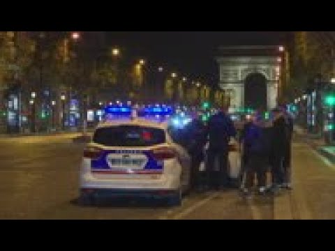 Paris streets quiet under first night of curfew