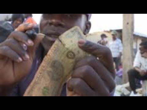 Traders repair damaged dollar bills for profit