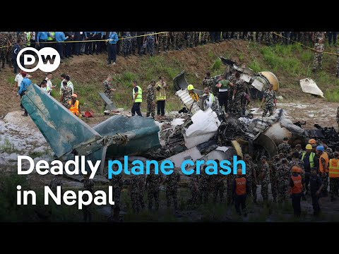 A plane crashes at Kathmandu's Tribhuvan International Airport killing 18 people | DW News