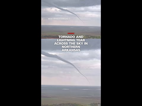 Tornado and lightning tear across the sky in northern Arkansas