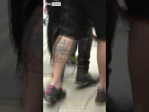 Rioters grab and smash camera