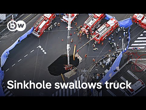 Search underway for Japanese man after truck falls into sinkhole | DW News