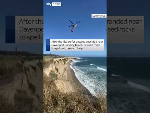 Kite surfer spells 'help' to get rescued