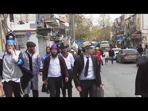 Ultra-Orthodox Jews celebrate traditional Purim holiday in the shadow of war in Gaza