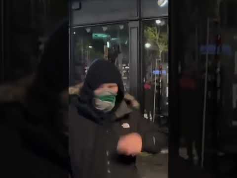 People loot a Foot Locker in Dublin