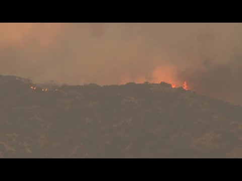 Lightning could worsen wildfire east of LA already threatening 35,000 homes and buildings