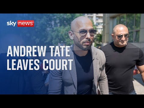 Andrew Tate leaves court in Romania