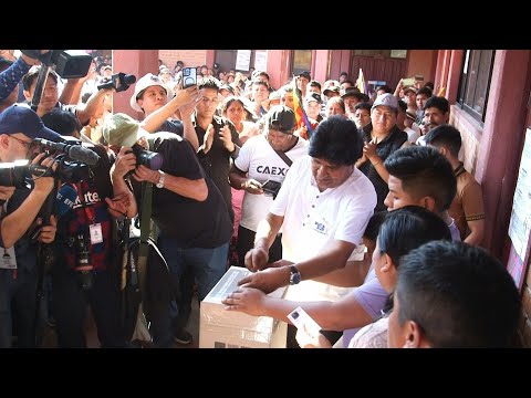 Barred from running, former president Evo Morales votes in Bolivia's general election | AFP