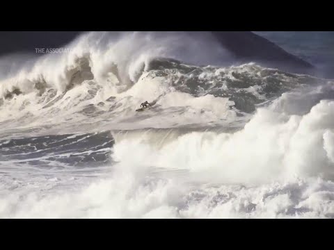 Surfers compete on powerful waves of over 13 feet in Brazil's Itacoatiara Big Wave event