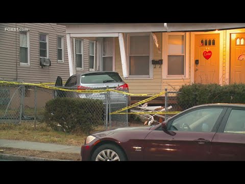 Driver hospitalized after car crashes into Hartford house