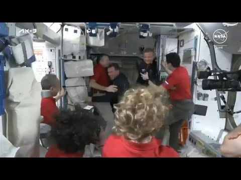 Hatch opens as ISS astronauts greet newly arrived colleagues from Axiom Mission 3