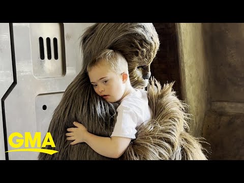 Young boy shares a sweet embrace with Chewbacca at Walt Disney World