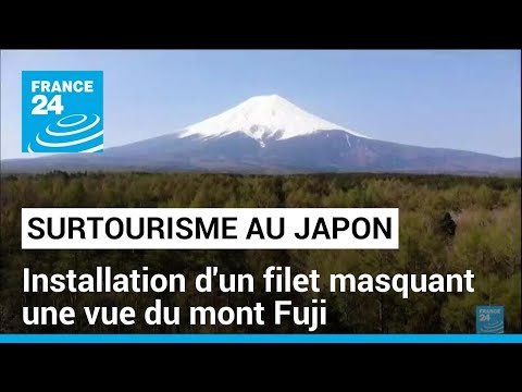 Japon : installation d'un filet masquant une vue du mont Fuji à cause du surtourisme • FRANCE 24