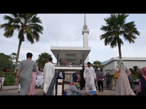 Ethnic Malay Muslims in Kuala Lumpur perform prayers to mark the start of Eid