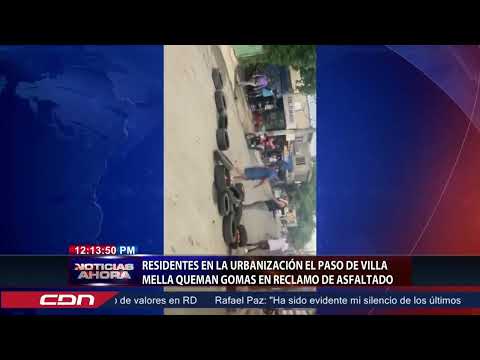 Residentes en la urbanización El Paso de Villa Mella queman gomas en reclamo de asfalto