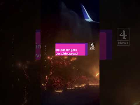 Airline passengers fly over widespread Hawaii wildfires