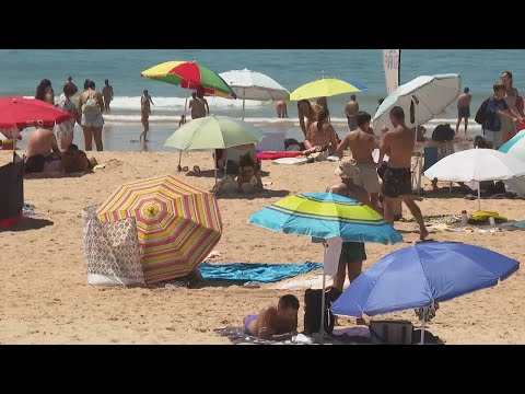 Pilgrims in Portugal enjoy beach ahead of pope vigil