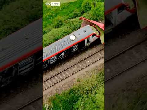 Train hits tractor trailer as arrest made
