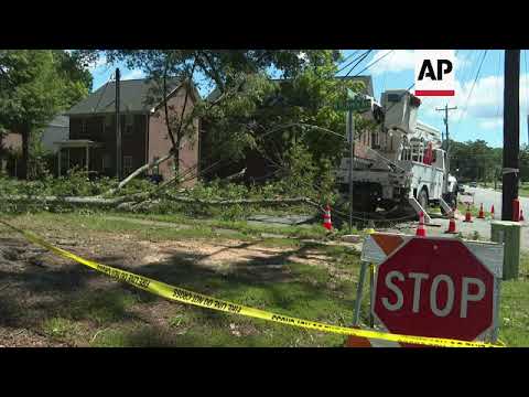 Mooresville community residents clean up debris after storm