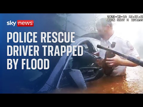 Atlanta: Police officers rescue driver trapped by flood