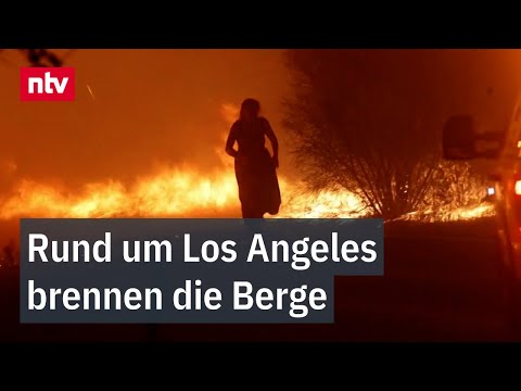 Frau zu Fuß im Flammenmeer: Rund um Los Angeles brennen die Berge | ntv