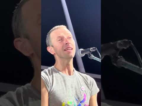 Chris Martin beautifully covers Elton John’s "Your Song" in the rain in Zurich.