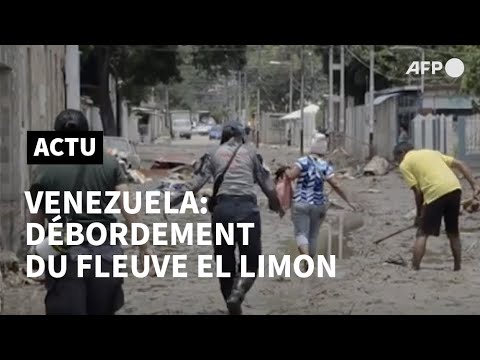 Les Vénézuéliens nettoient les rues après le débordement du fleuve El Limon | AFP