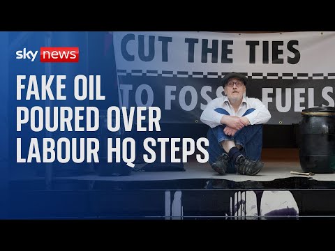 Extinction Rebellion activists pour fake oil over steps of Labour HQ