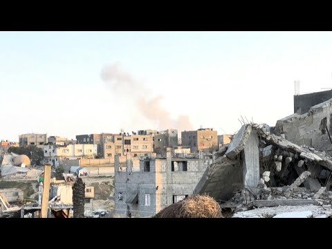 Smoke rises as helicopter flies over Gaza's Khan Yunis | AFP