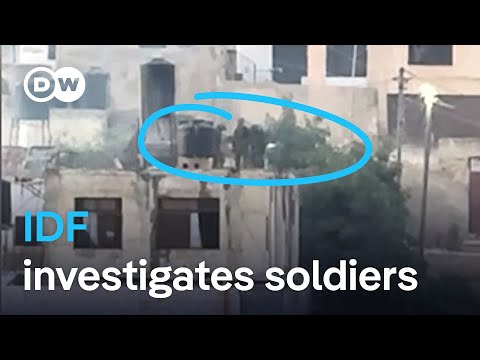 Videos show Israeli soldiers throwing apparently dead Palestinians off roof | DW News