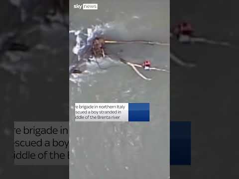 Boy rescued from flooding in Italy