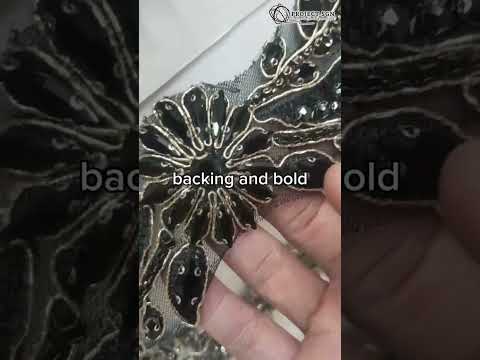 Gold-tone buttons with black enamel accents, perfect for adding a statement finish to any garment.