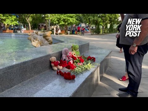 Residents of Sevastopol lay flowers at a makeshift memorial for victims of Ukrainian drone attack