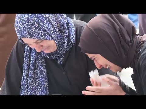 Relatives mourn over remains of Palestinians killed in Israeli airstrike on residential building in