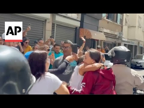 Venezuela opposition powerhouse Machado rides through Caracas to greet voters