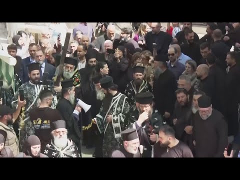 Orthodox Christian pilgrims mark Good Friday in the Old City of Jerusalem