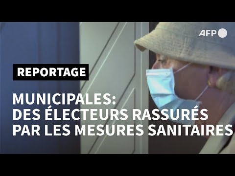 Municipales: mesures sanitaires renforcées, participation en baisse | AFP