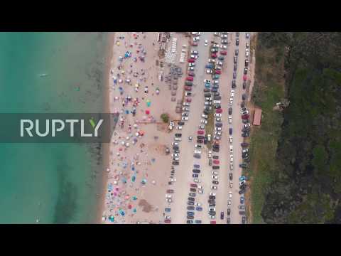 Greece: Locals flood Potamos Beach amid heatwave as coronavirus restrictions eased