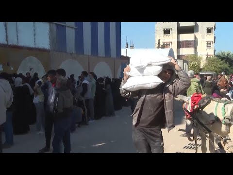 Gaza residents queue at UNRWA distribution centre amid truce