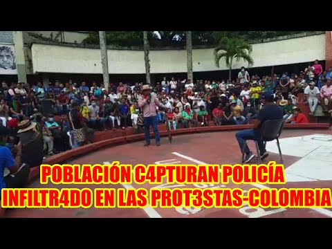 COLOMBIA POBLACIÓN C4PTURAN POLICÍA INFILTR4DO EN LAS PROT3STAS EN SECTOR DE LA LUNA EN CALI