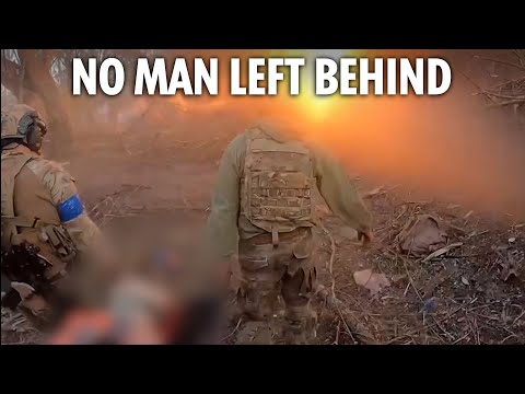 Fearless Ukrainian troops carry wounded comrade to safety as fiery explosions go off around them