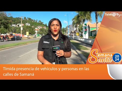Tímida presencia de vehículos y personas en las calles de Samaná