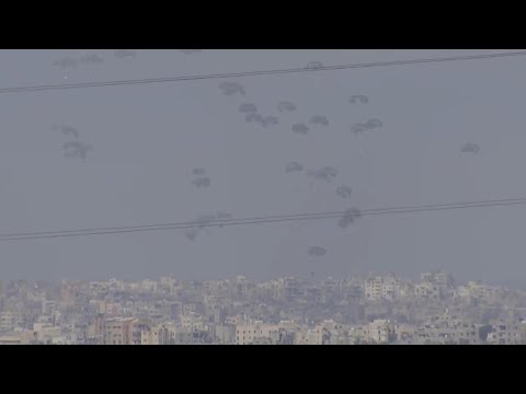 Parachutes drop aid supplies over Gaza Strip