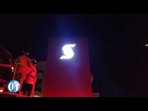 Man Atop of Scotiabank in Montego Bay