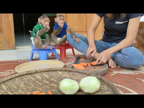 Mimi Kuku waits for her mother to peel the fruits and vegetables