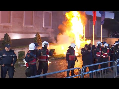 Former Albanian leader speaks at protest in Tirana, police pelted with stones and flares