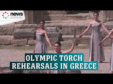 Sun's rays light Olympic torch in final rehearsal in Greece