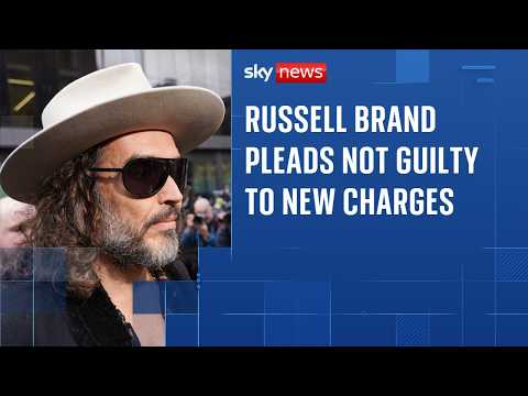 Russell Brand says he feels 'blessed' outside court before pleading not guilty