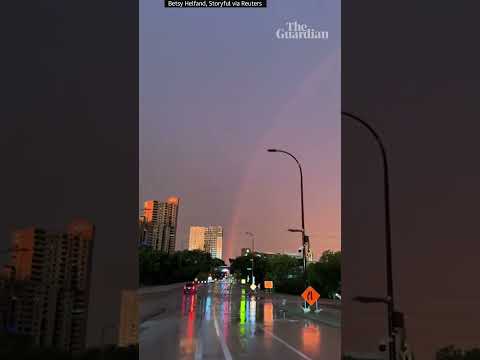 Moment lightning strikes around rainbow in Minneapolis storm
