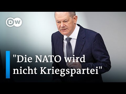 Scholz sagt Ukraine Solidarität und Hilfe zu, aber schließt NATO-Einsatz aus | DW Nachrichten